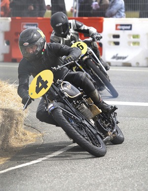 Bill leads a fellow ‘Velo Fellow’ through a corner. Photo courtesy  John Cosgrove Photography.